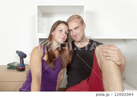 Young Couple Moving In Together 12002064