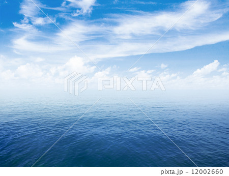 blue sea or ocean water surface with horizon and sky with clouds 12002660