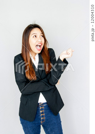 Portrait Asian lady speake out and smile on gray isolate Portrait Asian lady speake out and smile on gray isolate 12004310