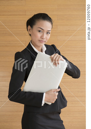 Asian Business Woman indoor with laptop computer 12009760