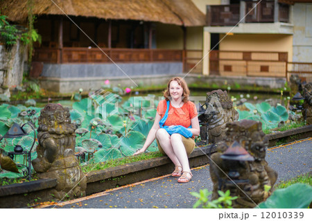 Tourist in Pura Saraswati temple in Ubud 12010339