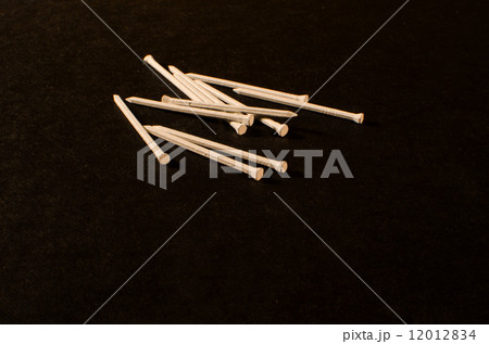 White nails at black background White nails at black background 12012834