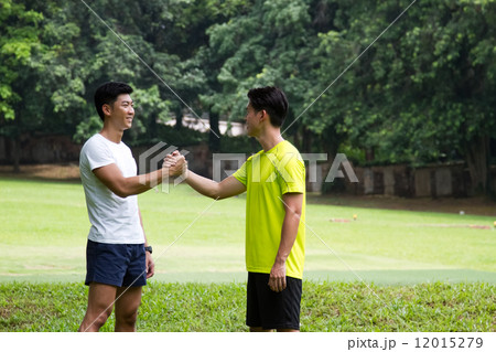 Men Clasping Hands Together Men Clasping Hands Together 12015279