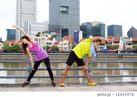 Man & Woman Stretching in the City Man & Woman Stretching in the City 12015478