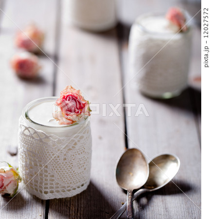 Rose flavor Greek yogurt in a glass jarwith lace 12027572