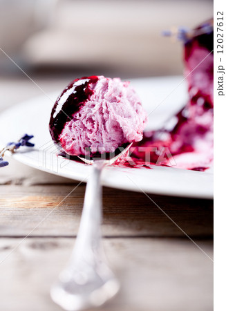 Berry ice cream with topping on a white plate Berry ice cream with topping on a white plate 12027612