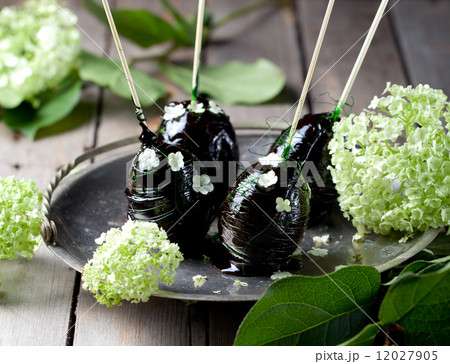 Easter eggs decorated with caramel and flowers 12027905