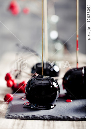 Halloween black and red caramelized apples Halloween black and red caramelized apples 12028094
