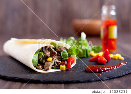 Beef fajitas roll with hot peppers, salad, corn Beef fajitas roll with hot peppers, salad, corn 12028251
