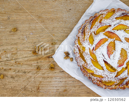Peach pie on a wooden desk Peach pie on a wooden desk 12030562