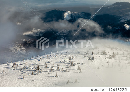 Peaks above clouds Peaks above clouds 12033226