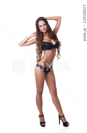 Beautiful underwear model posing in full growth 12038027