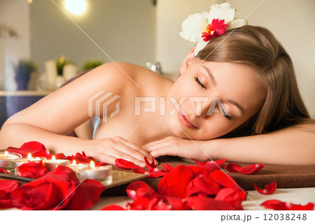 Beautiful young woman getting spa massage 12038248