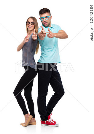Happy couple smiling holding thumb up gesture, beautiful young m 12042184