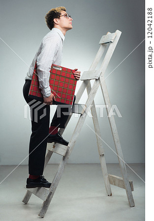 Businessman in career ladder concept Businessman in career ladder concept 12042188