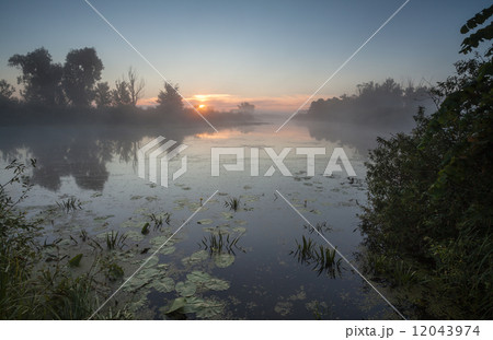 Amazingly beautiful sunrise over Lake, foggy Amazingly beautiful sunrise over Lake, foggy 12043974