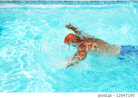 Man in swimming pool Man in swimming pool 12047195