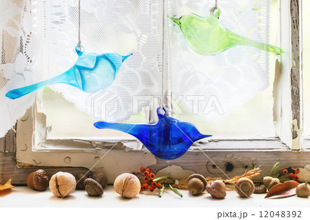 Interior window with glass birds and nuts Interior window with glass birds and nuts 12048392