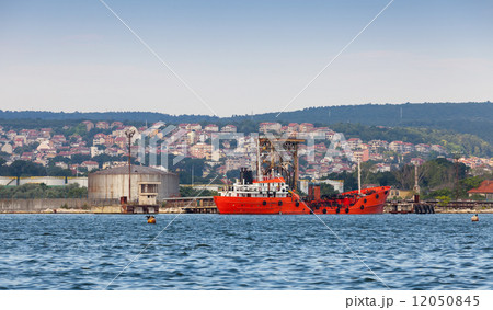 Tanker loading. Red cargo ship moored in Varna port, Bulgaria 12050845