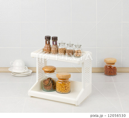 Plastic shelf with seasonings bottles Plastic shelf with seasonings bottles 12056530