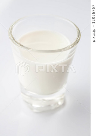 Mini glass of fresh low fat milk Mini glass of fresh low fat milk 12056767