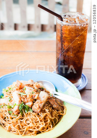 Fast meal with stir fried spicy noodles and cola Fast meal with stir fried spicy noodles and cola 12056839