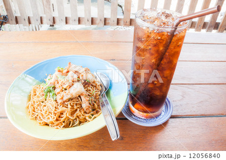 Easy meal with stir fried spicy noodles and cola Easy meal with stir fried spicy noodles and cola 12056840