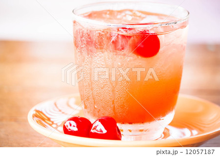 Glass of cold mix fruits juice soda on wood table Glass of cold mix fruits juice soda on wood table 12057187