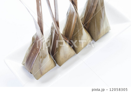 Steamed flour with coconut filling on white plate Steamed flour with coconut filling on white plate 12058305