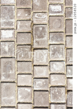 Path background fragment. Path made of small grey bricks. 12058520