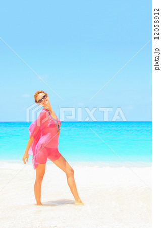 Beautiful young sexy woman by the sea in Greece 12058912