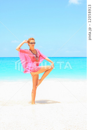 Beautiful young sexy woman by the sea in Greece 12058913