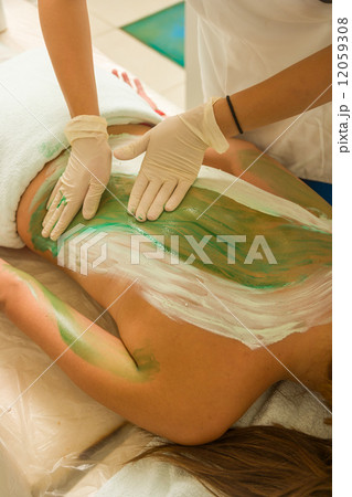 Woman Receiving A Mud Therapy 12059308