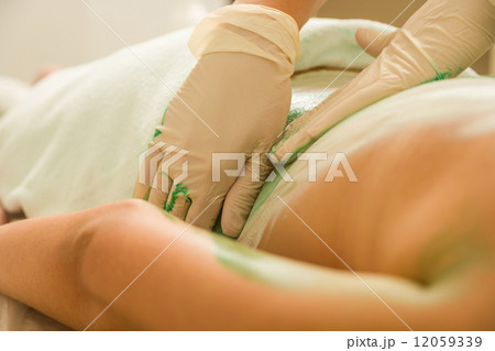Woman Receiving A Mud Therapy Woman Receiving A Mud Therapy 12059339