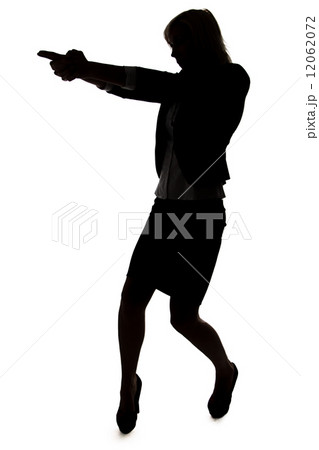Silhouette of agent woman with handgun 12062072