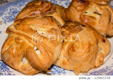 scones with cream on a plate 12062258