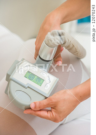 Therapist applying lipo massage LPG therapy Therapist applying lipo massage LPG therapy 12070243