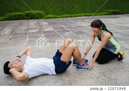 A young asian couple working out / exercise together in the urban city  12071948