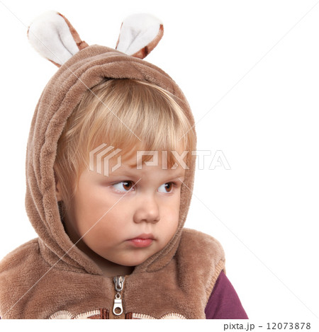 Portrait of serious Caucasian baby girl in bear costume isolated 12073878