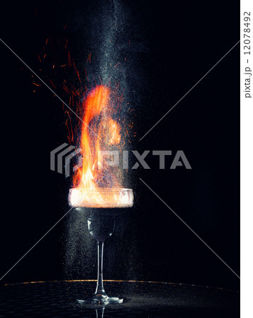 Flaming cocktail with gray pepper Flaming cocktail with gray pepper 12078492