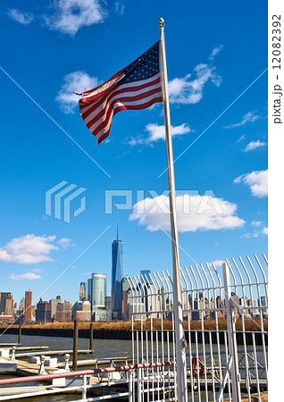 American flag with Manhattan skyline at background American flag with Manhattan skyline at background 12082392