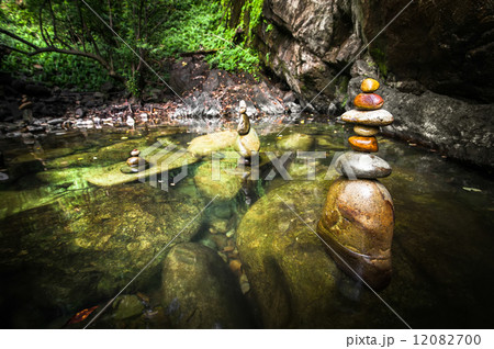 Tropical rain forest landscape with balancing rocks tower Tropical rain forest landscape with balancing rocks tower 12082700