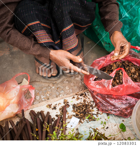 Selling green grocery and spices at traditional asian market Selling green grocery and spices at traditional asian market 12083301