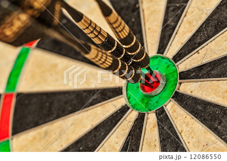 Three darts in bull's eye close up Three darts in bull's eye close up 12086550
