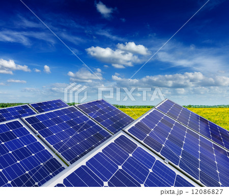 Solar battery panels in rural meadow field 12086827