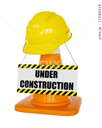 Yellow hard hat on highway traffic cone 12086918
