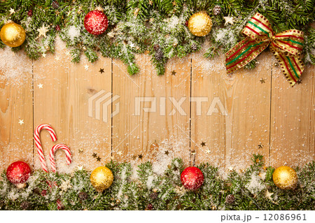 Christmas background with firtree, candies and baubles with snow 12086961
