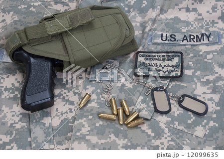 US army concept with dog tags, camouflaged uniform with patches US army concept with dog tags, camouflaged uniform with patches 12099635