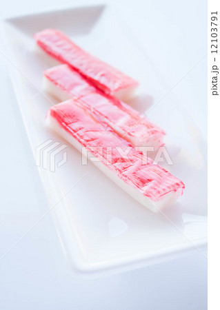Crab sticks group on white plate 12103791