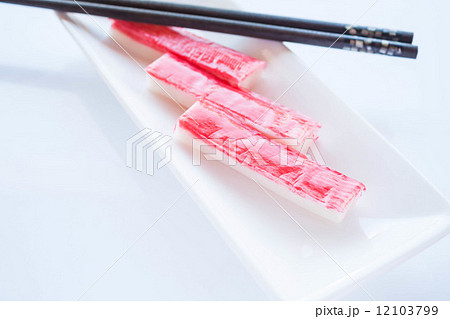 Crab sticks group with chopsticks on white plate 12103799